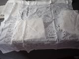 a table with a white table cloth and a pair of scissors on it