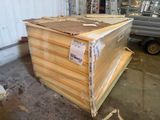 a pile of wood sitting in a warehouse next to a truck