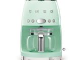 an image of a green toaster on a white background