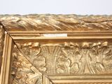 a picture of a gold frame with a picture on it