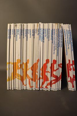 several books are stacked on top of each other on a table