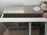 an overhead view of a commercial kitchen with stainless steel appliances