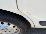 a close up of a car ' s tire on the street