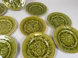 many plates with different designs on them on a table