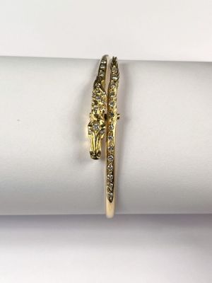 a close up of a ring on a napkin on a white surface