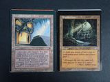 two cards that are sitting on a table