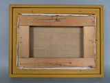 an old picture frame with a picture of a bird on it