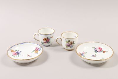 four pieces of porcelain dishes and cups on a white surface