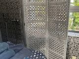 a room with a bed and a screen in it