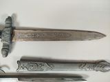 three different types of knives on display on a table