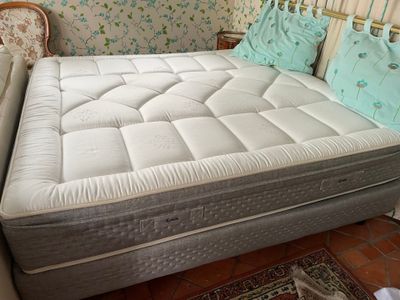 a mattress that is sitting on a bed in a room