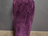 a mannequin wearing a purple skirt with a white top
