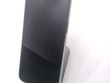 a cell phone that is sitting on top of a stand
