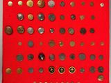 a close up of a red cloth with a bunch of coins on it