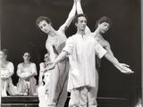 an old black and white photo of a group of people on stage