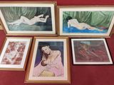 three framed pictures of a woman laying on a bed with a baby in her lap