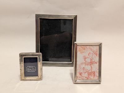 two silver picture frames with a picture of a horse and a picture of a horse
