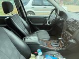 a car that has a bunch of items in the front seat
