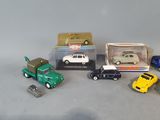 a lot of toy cars that are sitting on a table