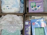 several boxes of baby products are stacked on top of each other