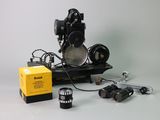 a black and white photo of a camera and some other items