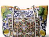a white bag with a floral design on it