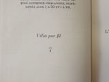 an open book with a black and white image of a cat