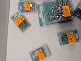many different types of screws and screws on the table