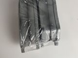 four pieces of plastic on a white surface
