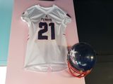 a football jersey and a helmet on a table