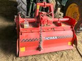 a red machine that is sitting in the dirt