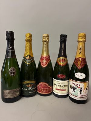 six bottles of champagne lined up in a row on a table