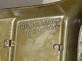 a close up of a metal object with a tag on it