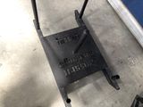 a small metal step stool that is sitting on the floor
