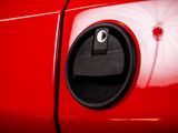 a close up of a red car door handle