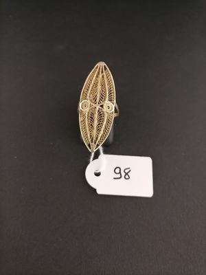 an image of a gold ring with a leaf design on it