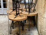 four chairs that are sitting on the side of a building