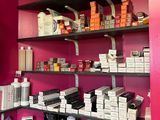 a shelf with many different types of hair products on it