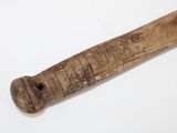 a wooden baseball bat that is laying on a table