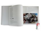an open book with a picture of a man holding a knife