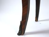 a close up of the legs and legs of a wooden table