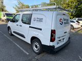 a white van that is parked in a parking lot