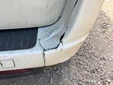 a crack in the front of a car ' s bumper