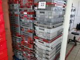 a large stack of boxes in the middle of a room