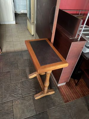 a small table in the middle of a kitchen