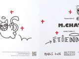 an open book with a drawing of a cat on it
