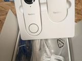 a white box with a pair of ear buds in it