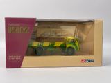 toy truck in a box on a white surface with a pink box
