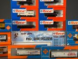 several boxes of toy trains are stacked on top of each other