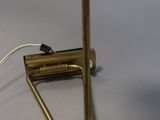 a lamp that is sitting on a table with a cord